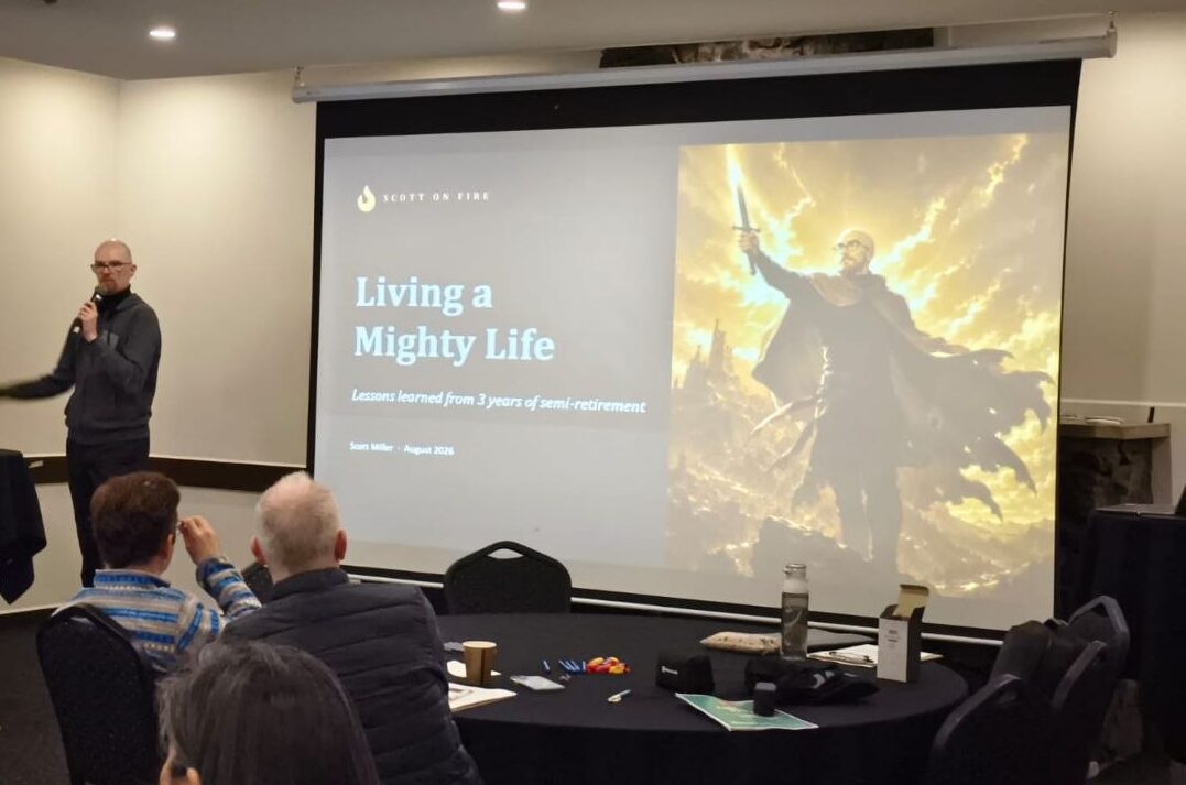 A man is delivering a presentation titled Living a Mighty Life